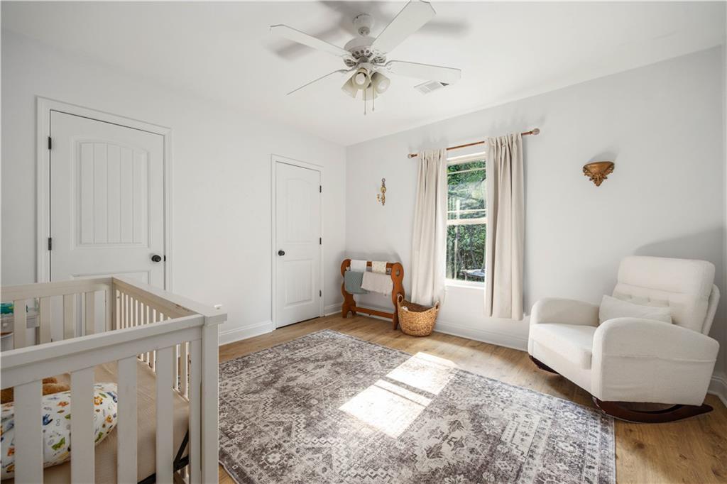 19 Isbell Road Fort Mitchell, AL 36856 - Photo 25 of 37 Bright interior with wood-finish flooring, two panel doors, and a ceiling fan
