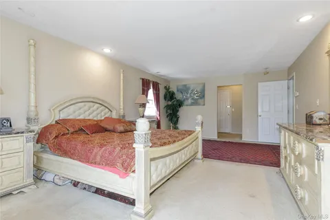 a bathroom with a bathtub a sink and a mirror