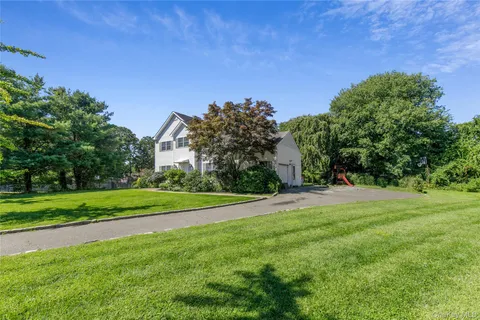 a view of a field of grass and trees