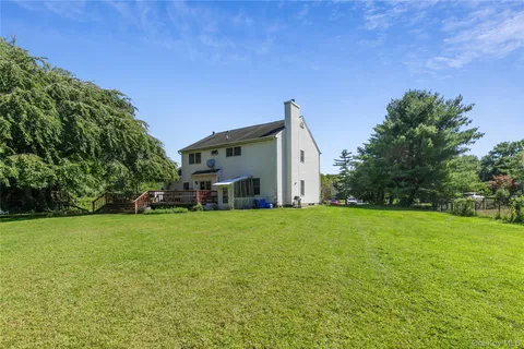a view of a yard with a tree