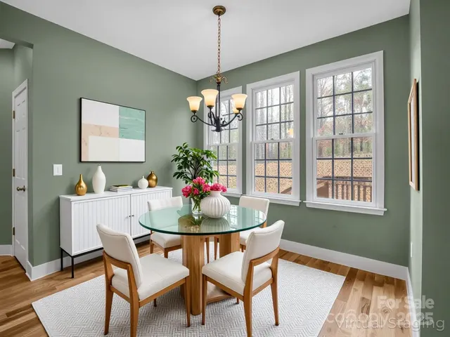 a dining room with furniture and window