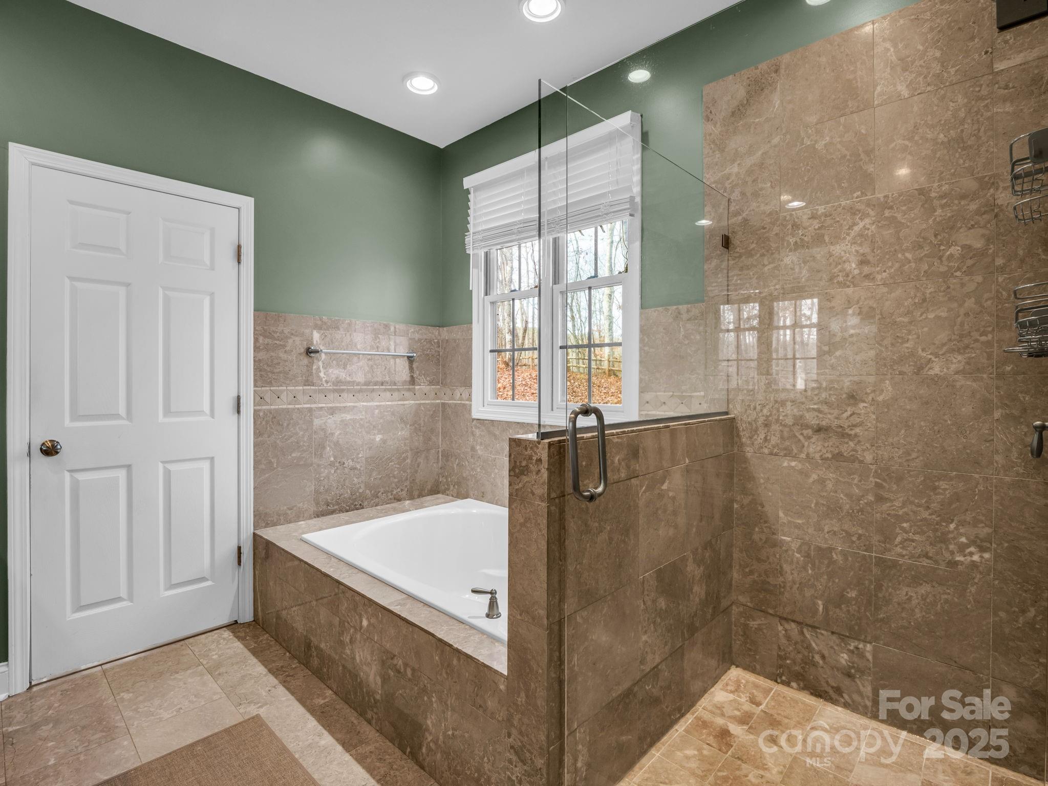 351 East Rambling Creek Drive Tryon, NC 28782 - Photo 21 of 48 a bathroom with a bathtub and a shower