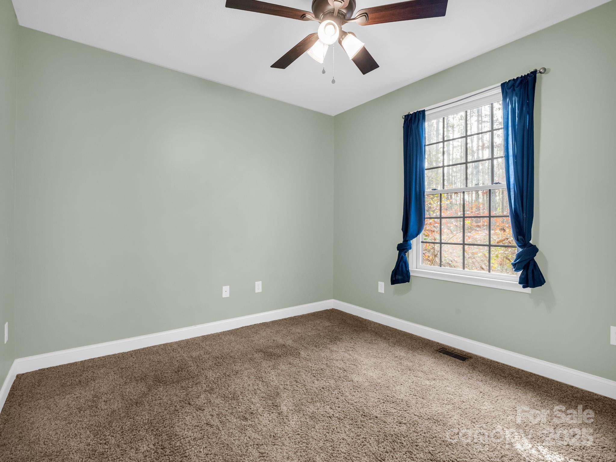 351 East Rambling Creek Drive Tryon, NC 28782 - Photo 26 of 48 wooden floor in an empty room with a window