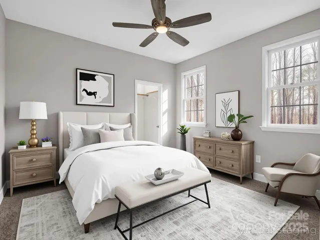 a bedroom with a bed a couch and window