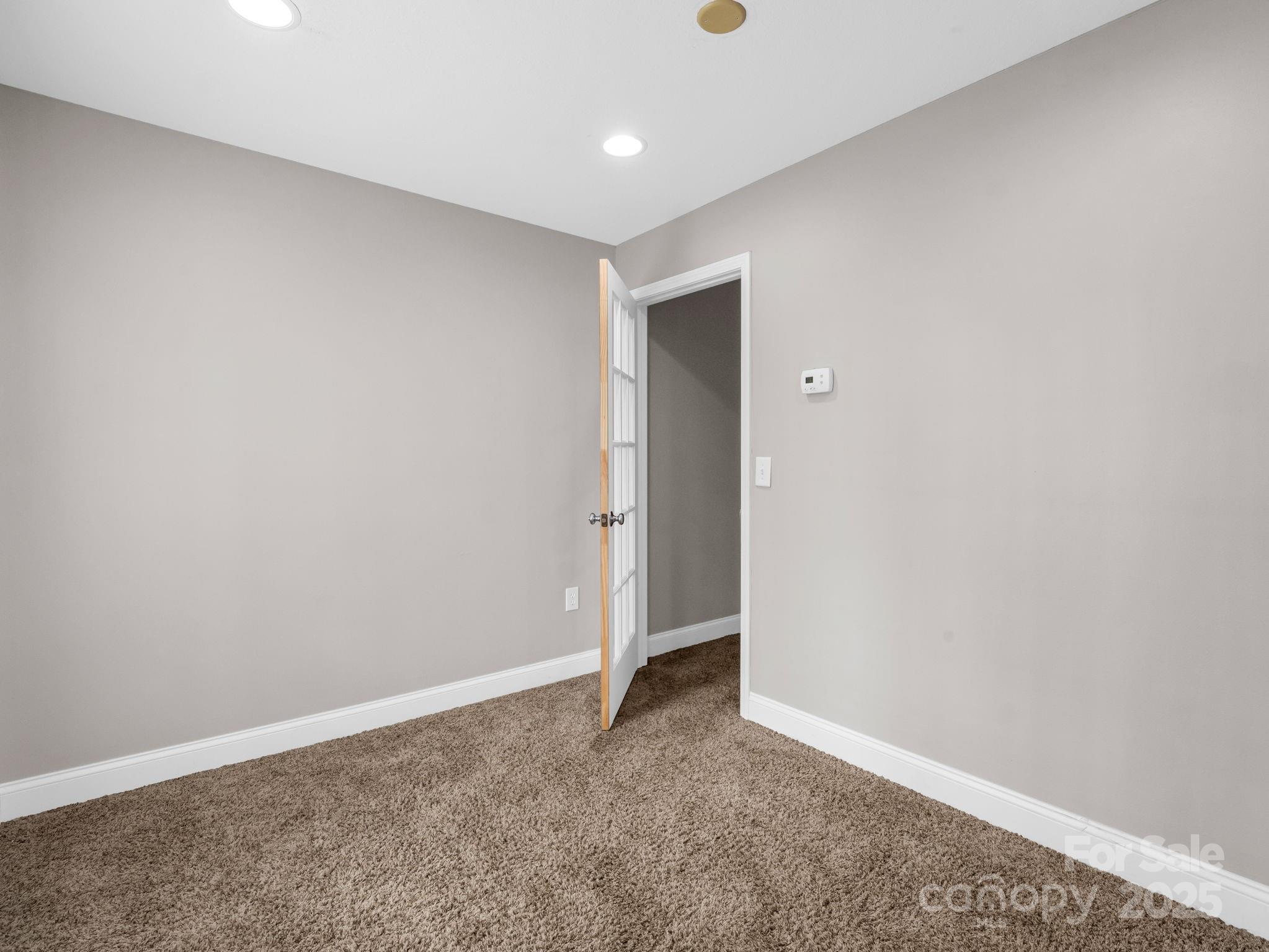 351 East Rambling Creek Drive Tryon, NC 28782 - Photo 38 of 48 a view of an empty room