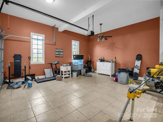 a room with gym equipment and a large mirror