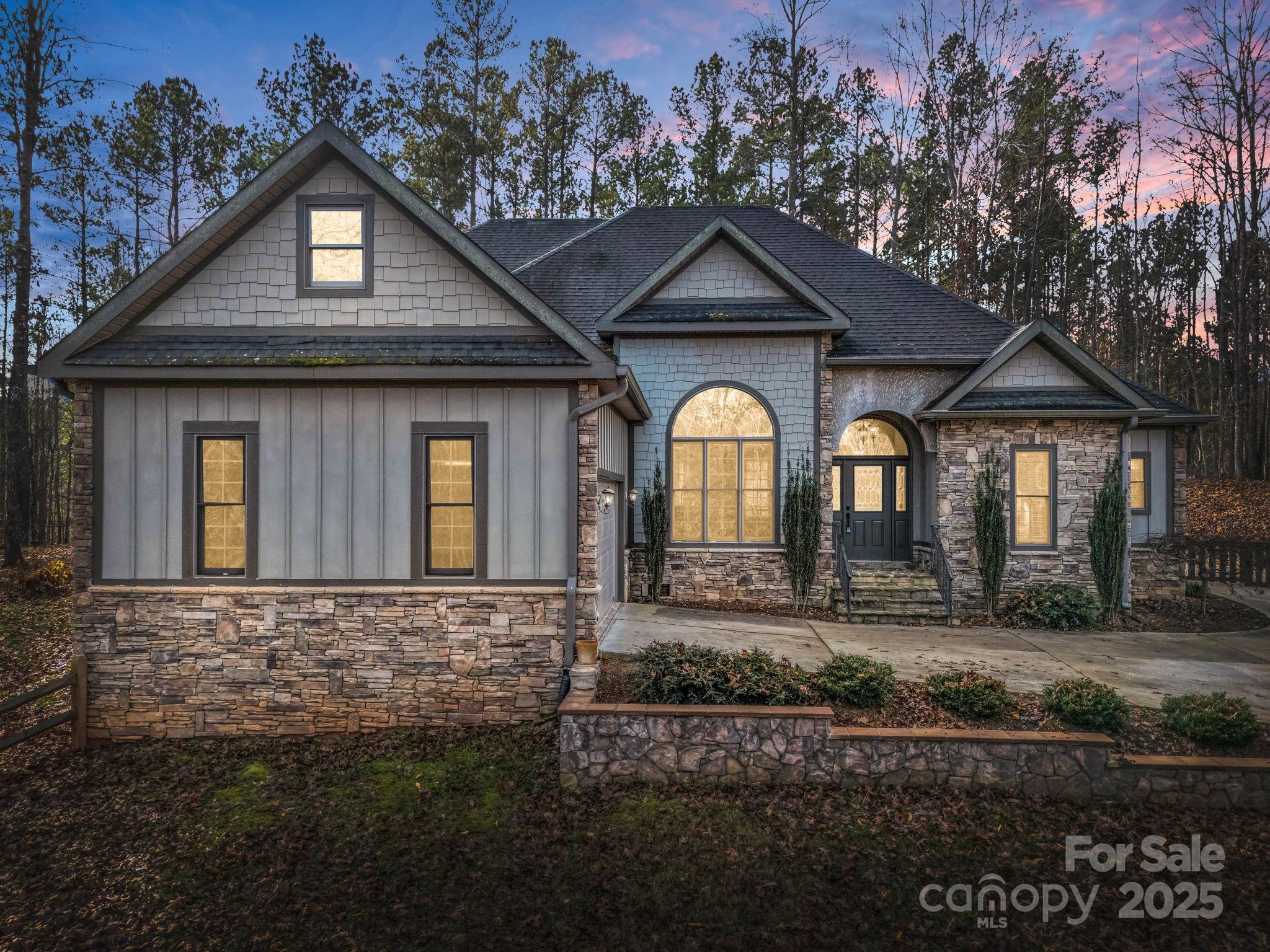 351 East Rambling Creek Drive Tryon, NC 28782 - Photo 48 of 48 a front view of a house with garden
