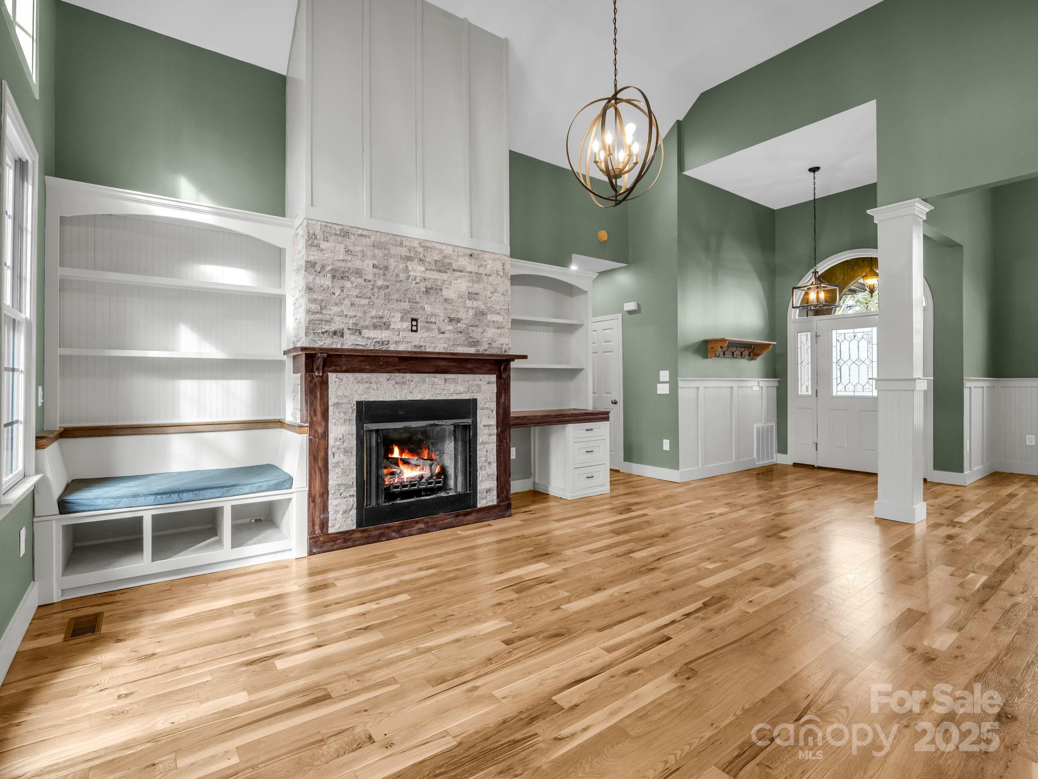 351 East Rambling Creek Drive Tryon, NC 28782 - Photo 6 of 48 a view of a livingroom with wooden floor a fireplace and window