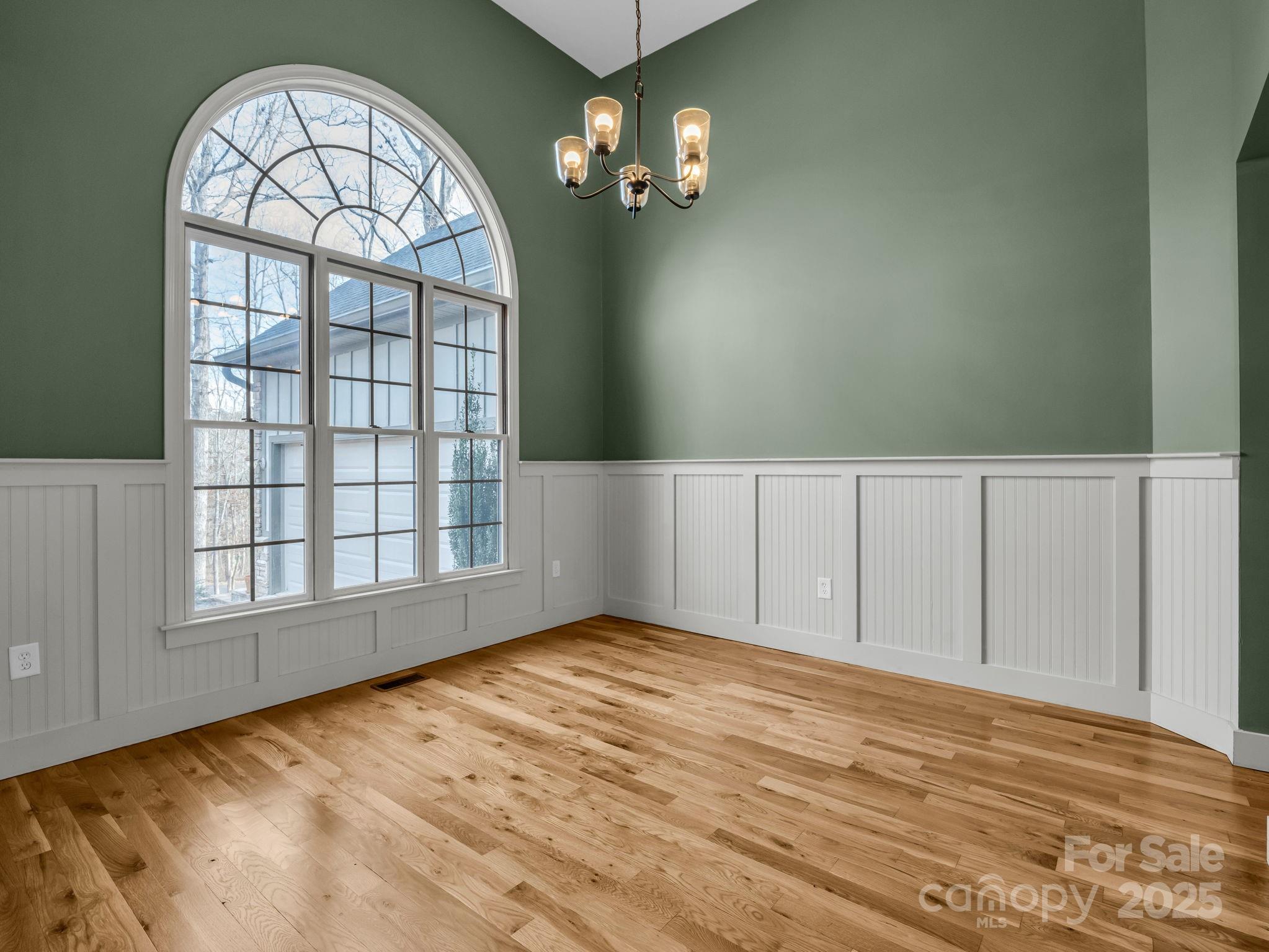 351 East Rambling Creek Drive Tryon, NC 28782 - Photo 8 of 48 wooden floor in an empty room with a window