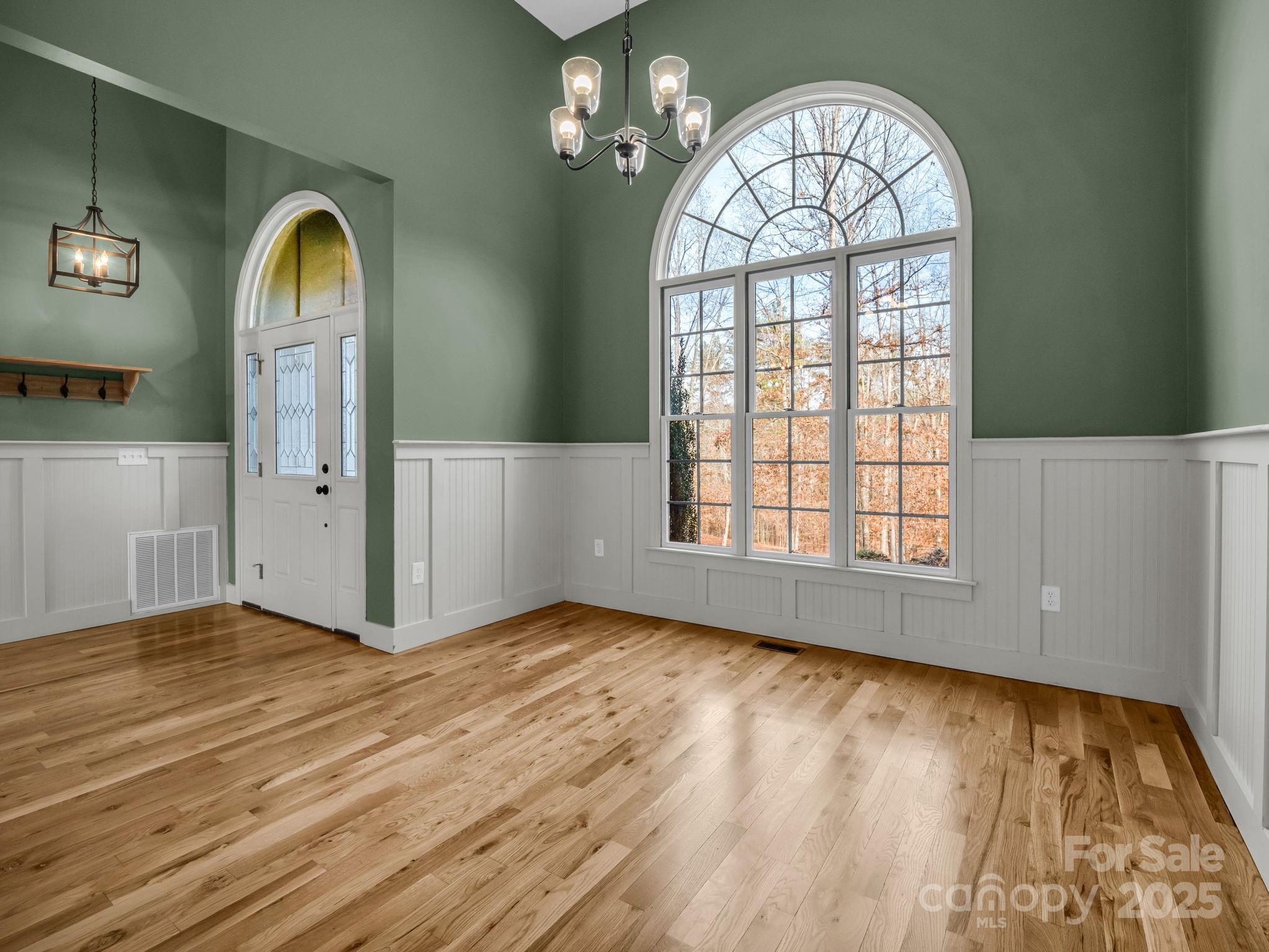 351 East Rambling Creek Drive Tryon, NC 28782 - Photo 9 of 48 a view of front door with wooden floor and a window