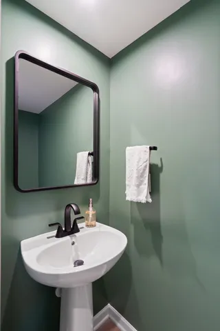 a bathroom with a sink and mirror
