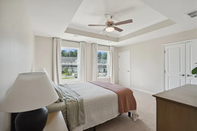 a bedroom with a bed and window