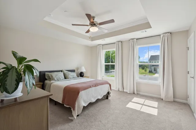 a bed room with a bed and a window