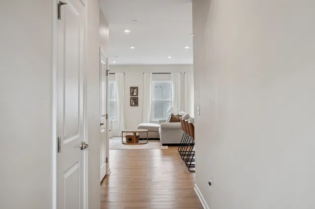 a view of living room with furniture and a view of bathroom