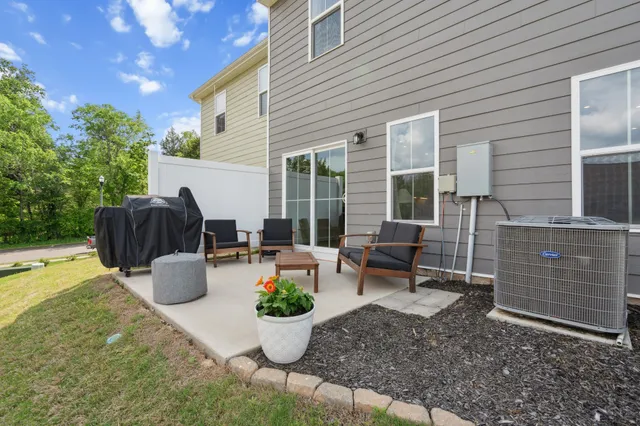 a view of a backyard with garden and patio