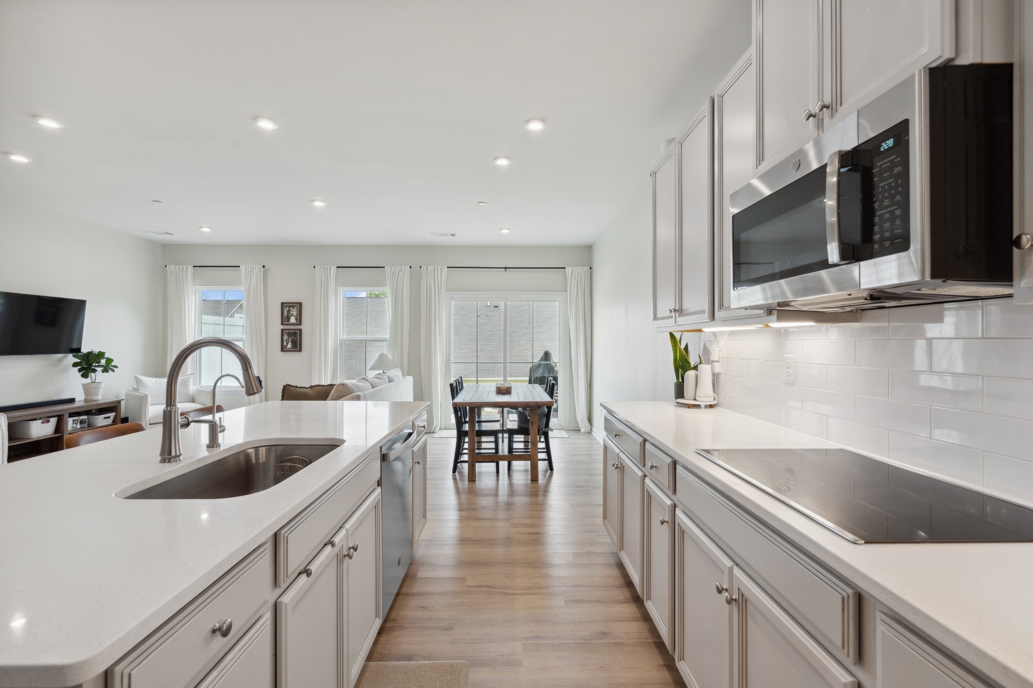 159 Keelon Gap Road Spring Hill, TN 37174 - Photo 7 of 23 a kitchen with stainless steel appliances a sink microwave and cabinets