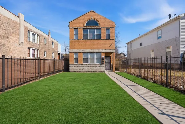 a front view of a house with yard