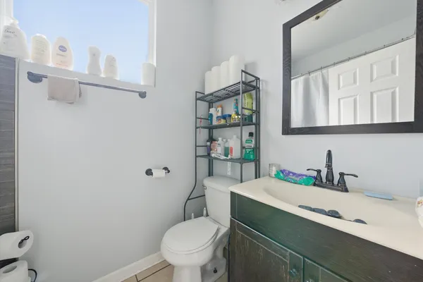 a white refrigerator freezer sitting inside of a kitchen