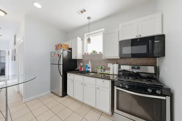 a view of a livingroom with furniture and windows