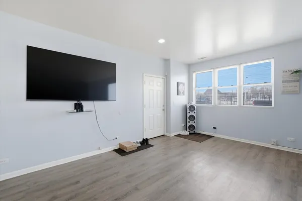 a view of dining room with furniture and wooden floor
