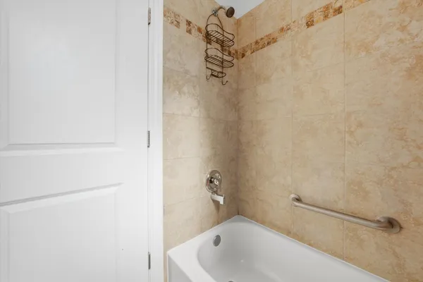a view of a hallway with washer and dryer