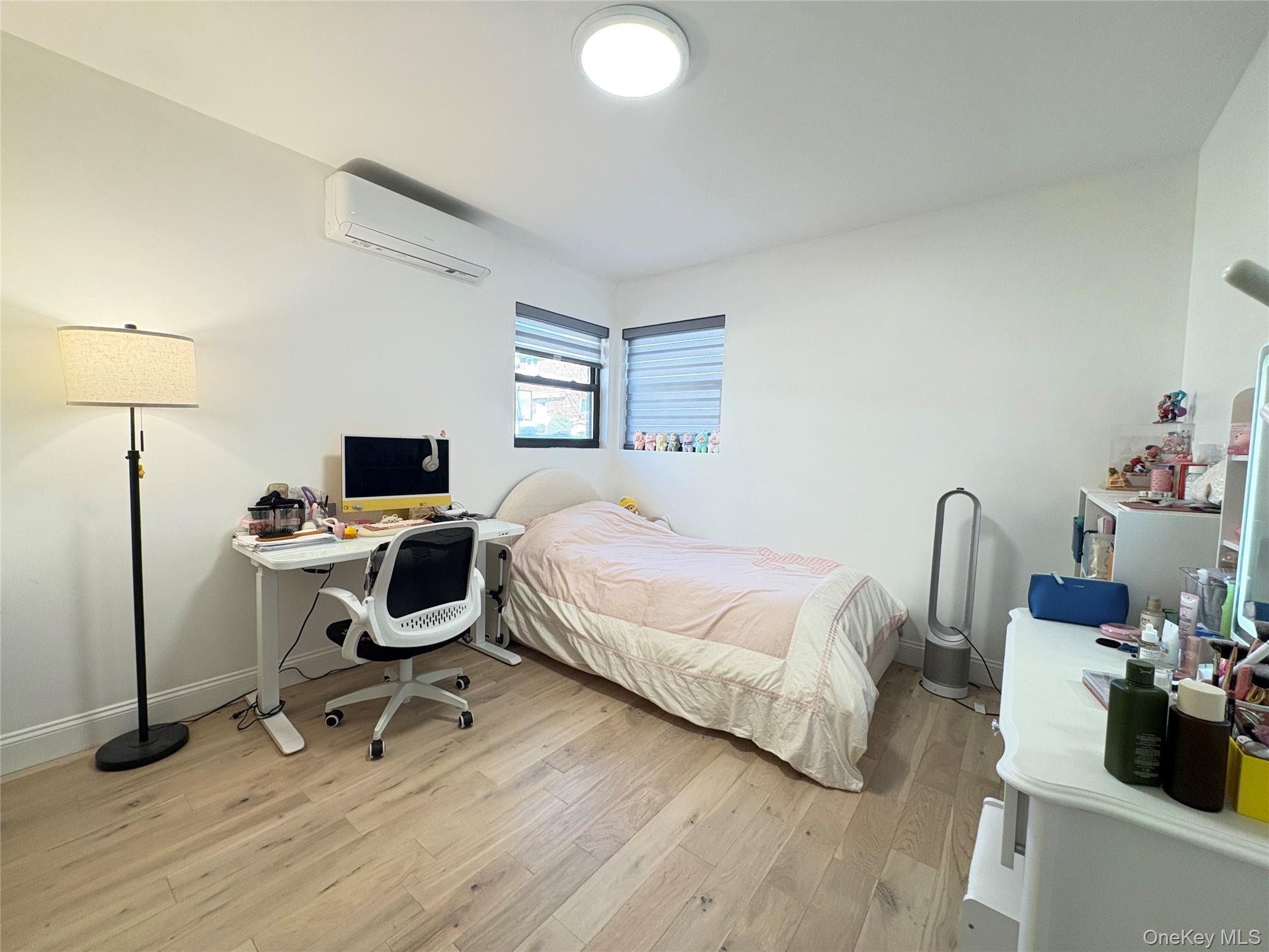 41-75 Morgan Street Queens, NY 11363 - Photo 16 of 50 a bedroom with a bed and a desk