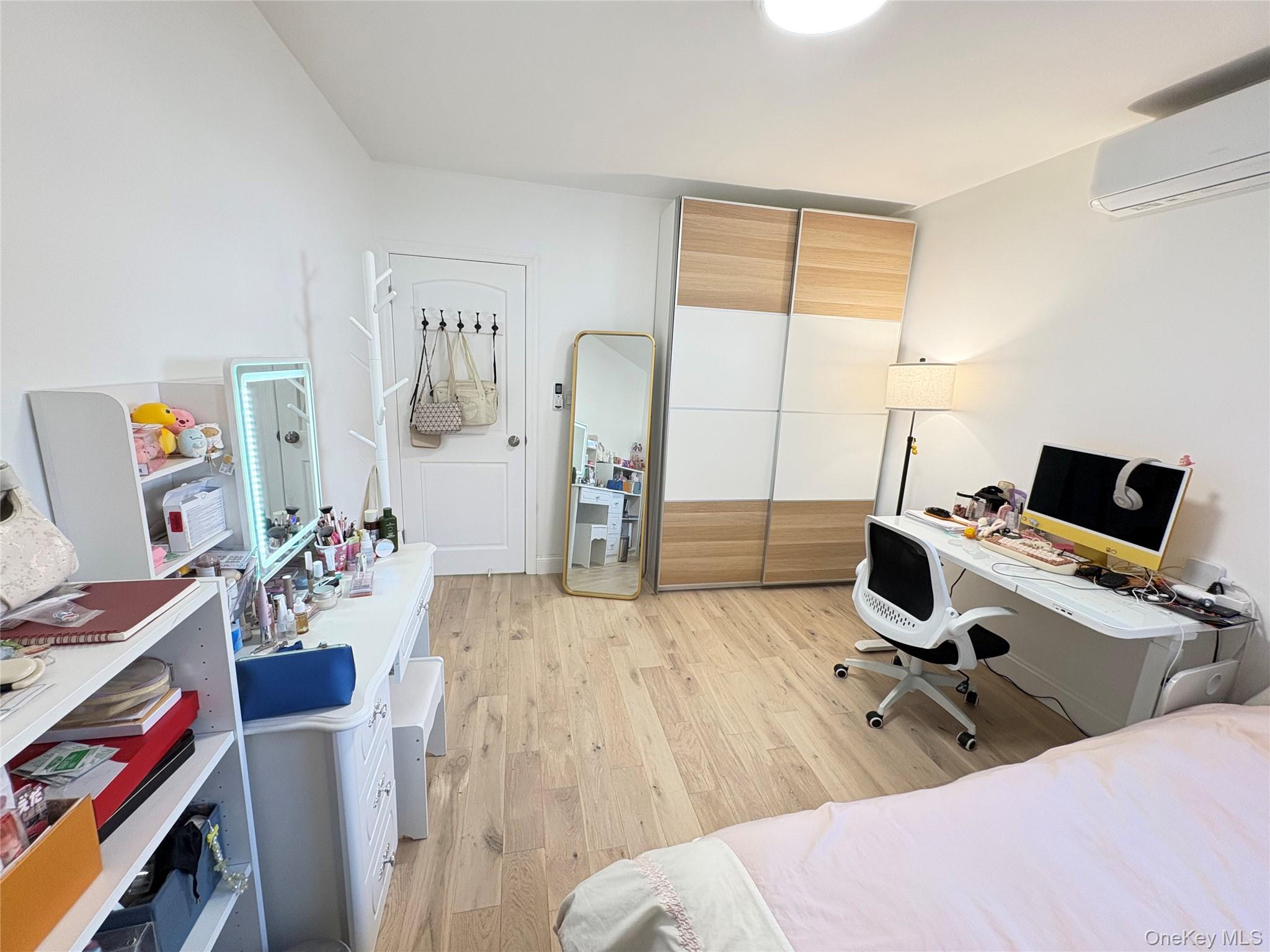 41-75 Morgan Street Queens, NY 11363 - Photo 17 of 50 a bed room with a bed and a desk