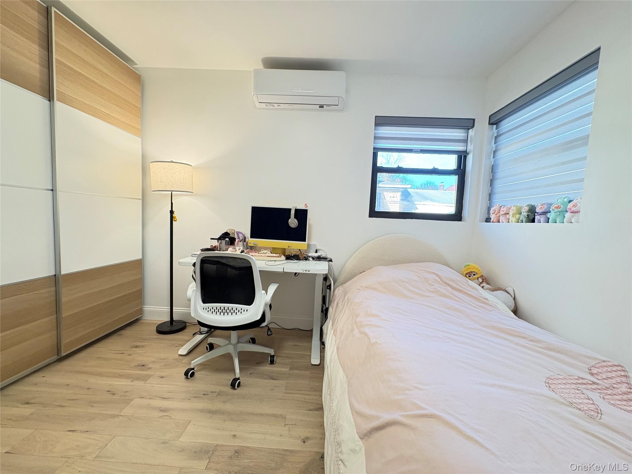 41-75 Morgan Street Queens, NY 11363 - Photo 18 of 50 a bedroom with a bed and chair