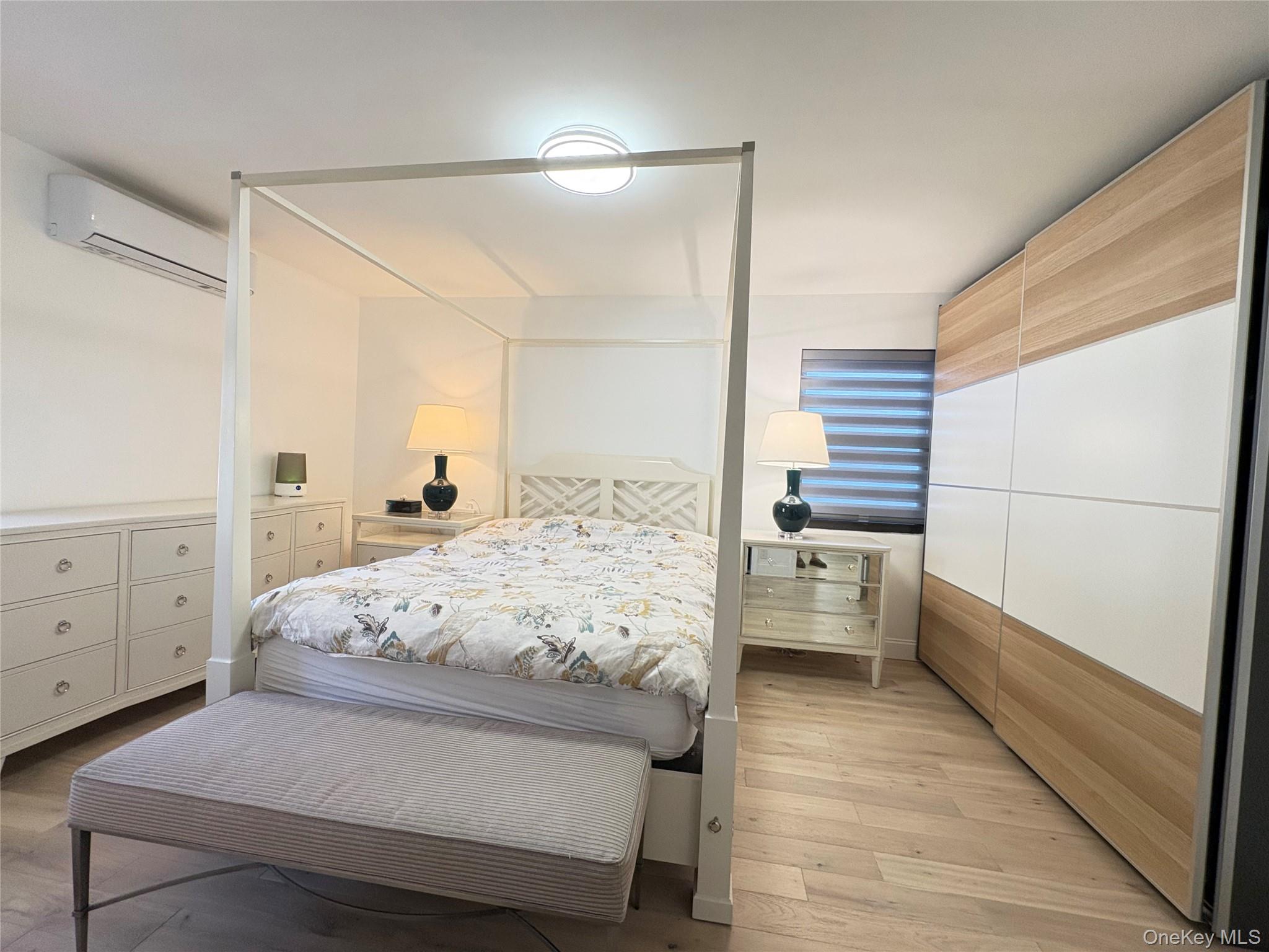 41-75 Morgan Street Queens, NY 11363 - Photo 20 of 50 a bedroom with a bed and a dresser