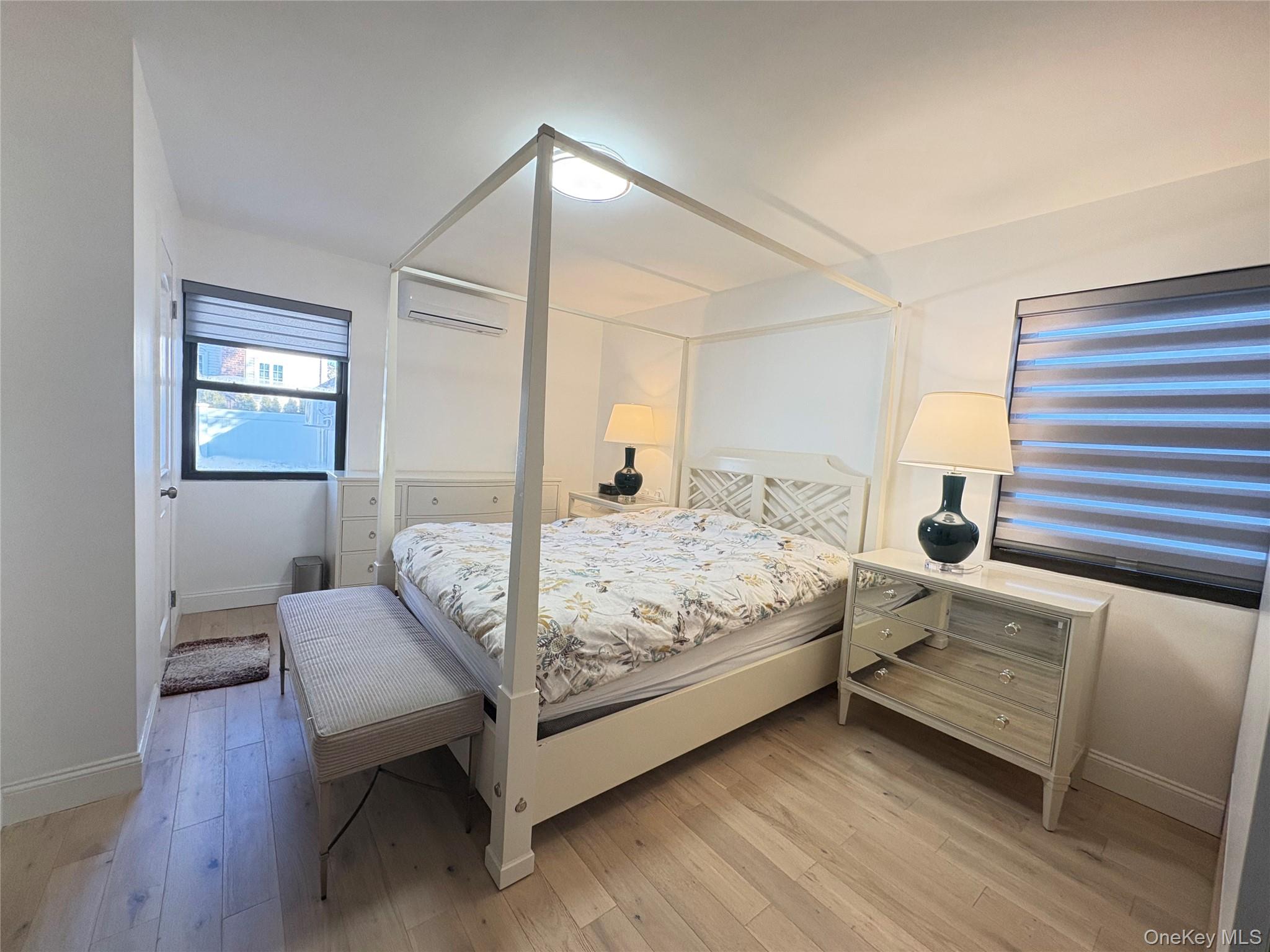 41-75 Morgan Street Queens, NY 11363 - Photo 21 of 50 a bedroom with a bed and wooden floor