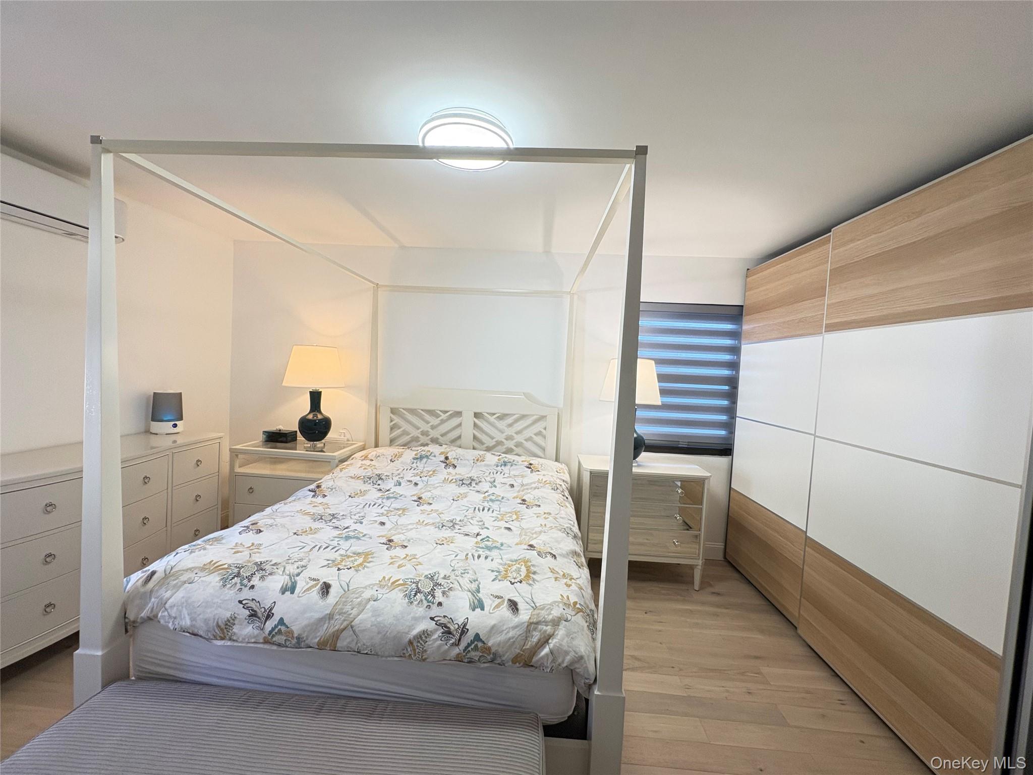 41-75 Morgan Street Queens, NY 11363 - Photo 23 of 50 a bedroom with a bed and a large mirror