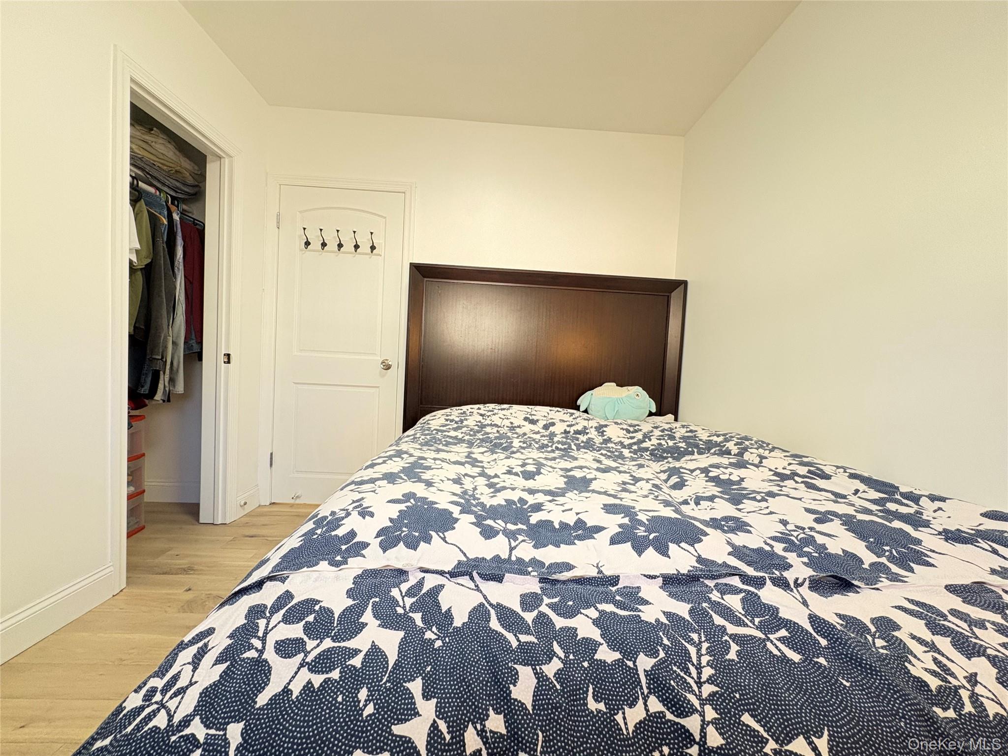 41-75 Morgan Street Queens, NY 11363 - Photo 25 of 50 a bedroom with a bed and wooden floor