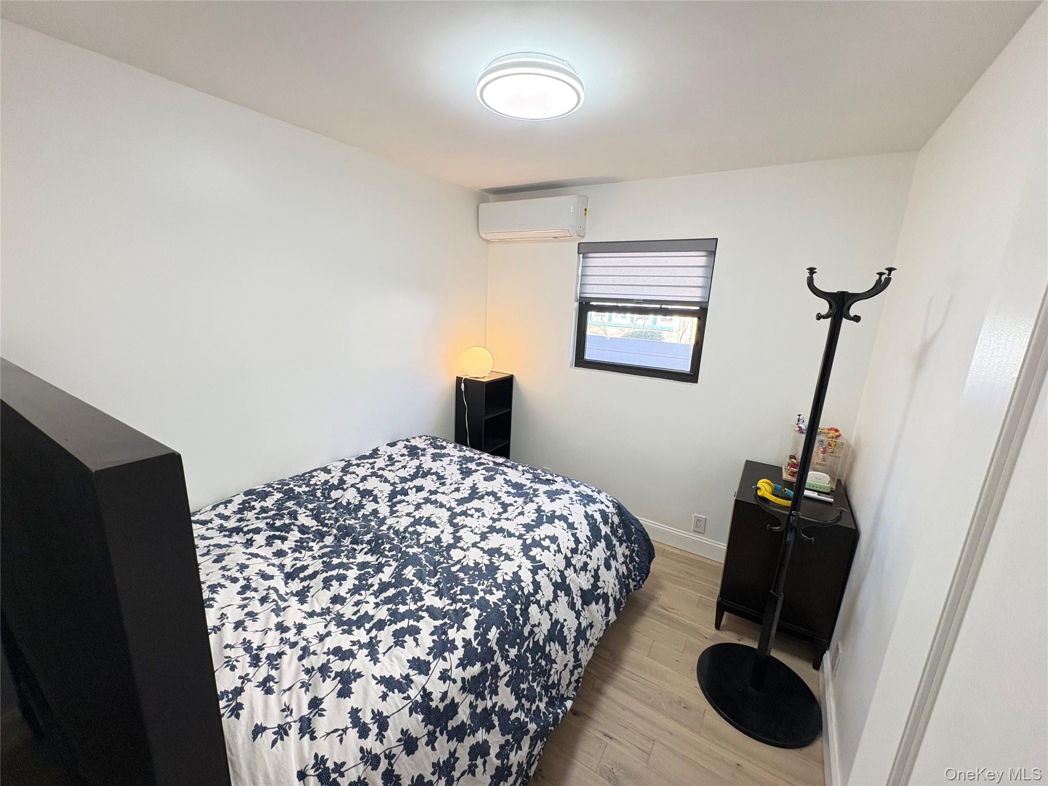 41-75 Morgan Street Queens, NY 11363 - Photo 26 of 50 a bedroom with a bed and a walk in closet