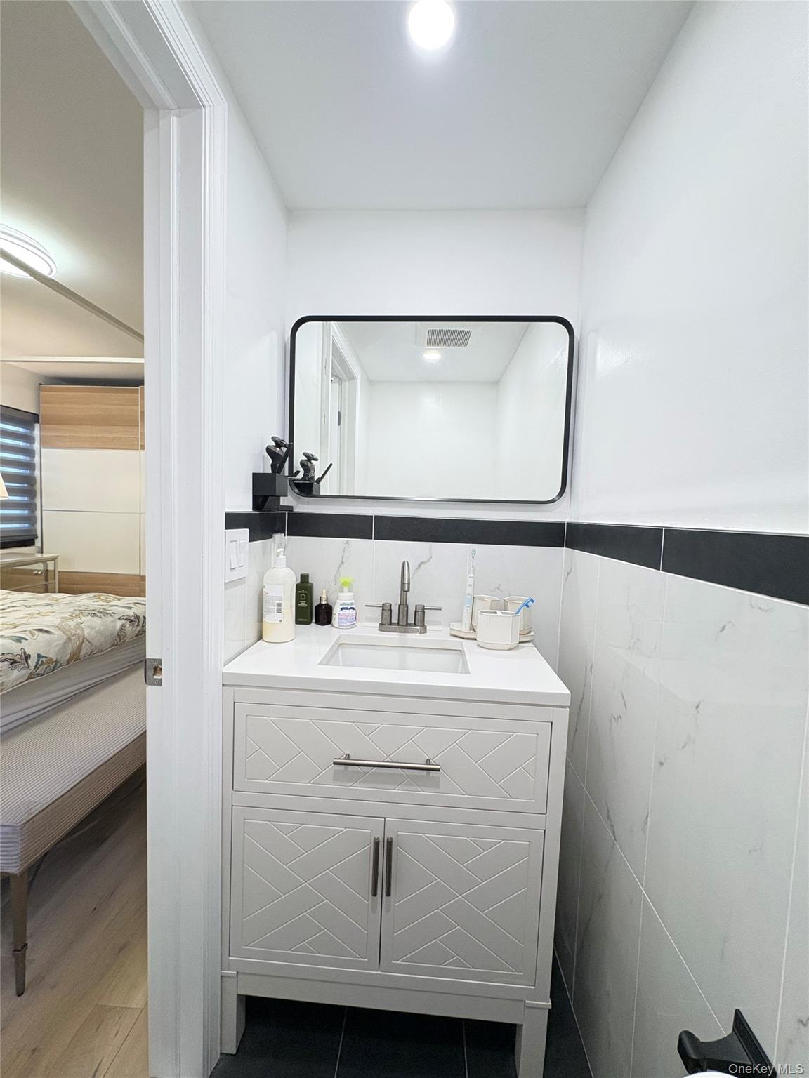 41-75 Morgan Street Queens, NY 11363 - Photo 28 of 50 a bathroom with a sink and a mirror