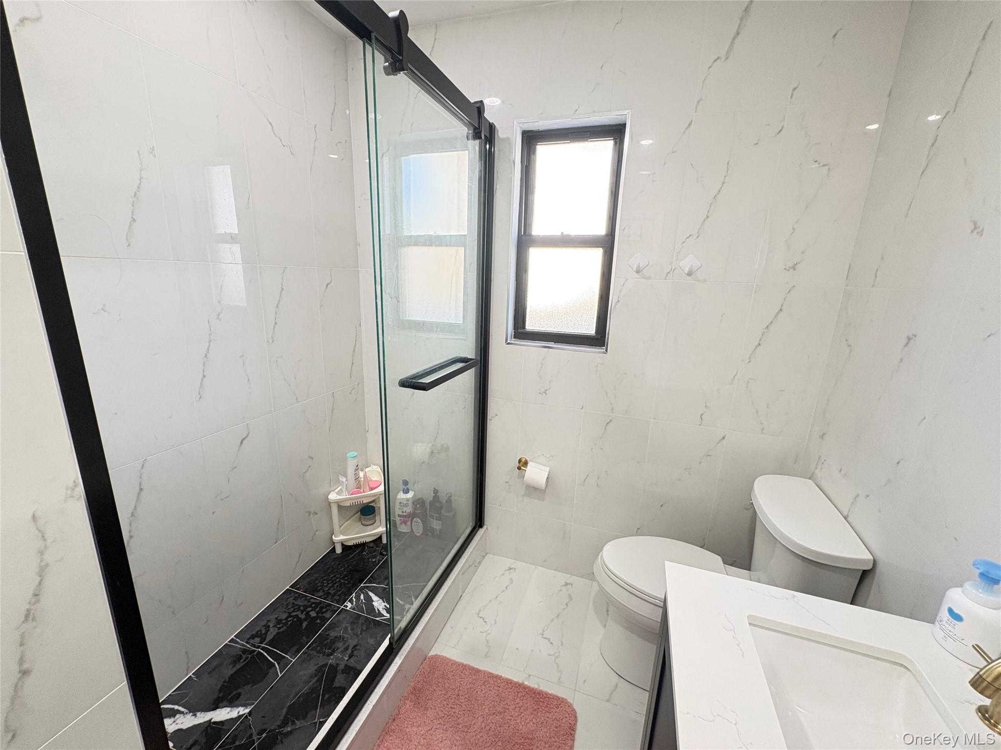 41-75 Morgan Street Queens, NY 11363 - Photo 30 of 50 a bathroom with a toilet and a shower