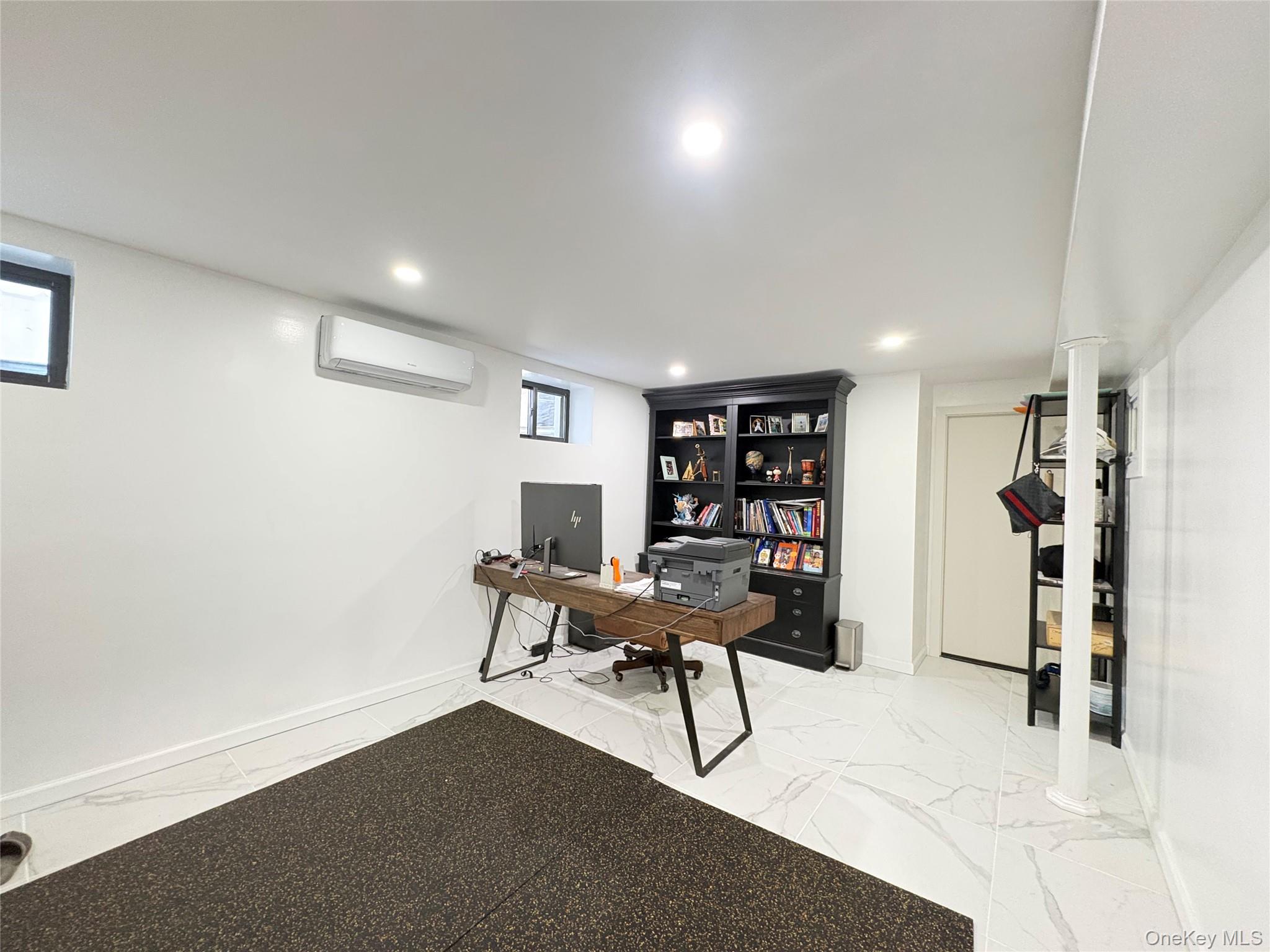 41-75 Morgan Street Queens, NY 11363 - Photo 32 of 50 a work room with furniture and a book shelf