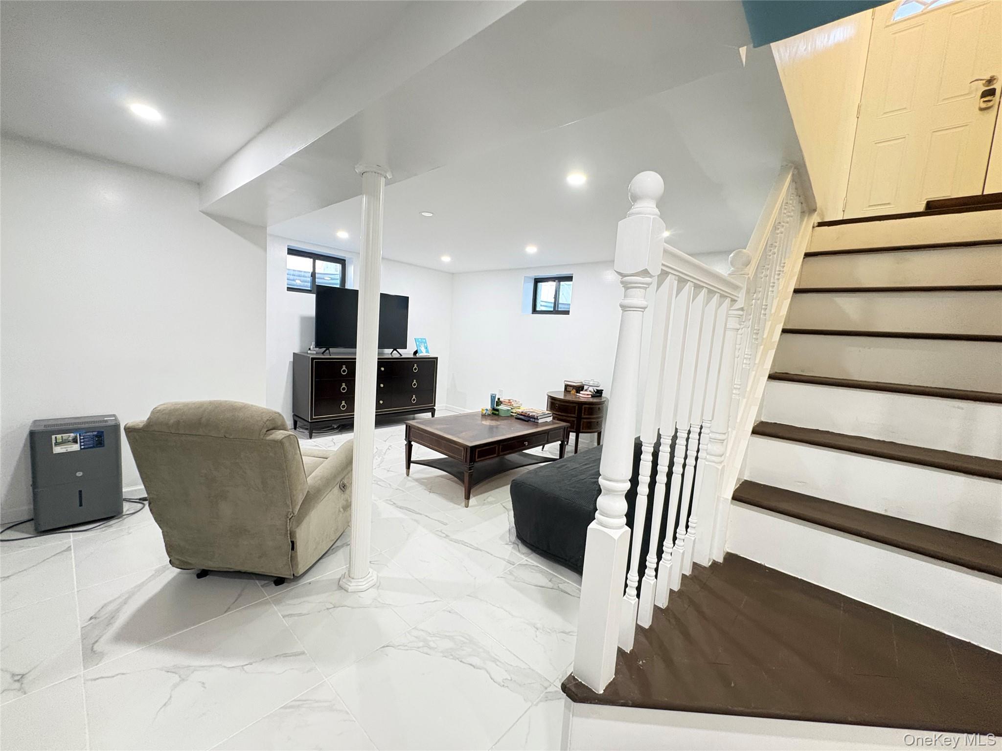 41-75 Morgan Street Queens, NY 11363 - Photo 34 of 50 a living room with furniture and a wooden floor