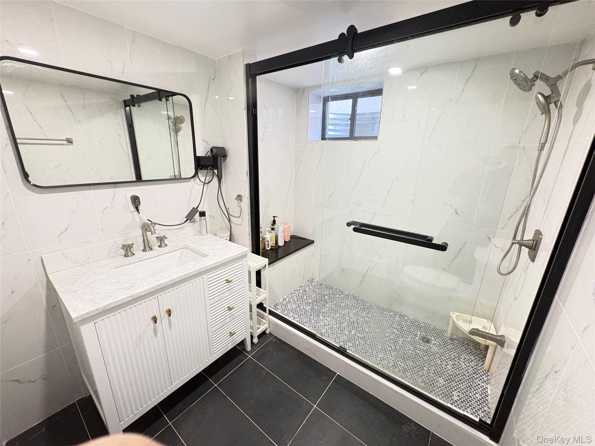 41-75 Morgan Street Queens, NY 11363 - Photo 37 of 50 a bathroom with a sink and a mirror