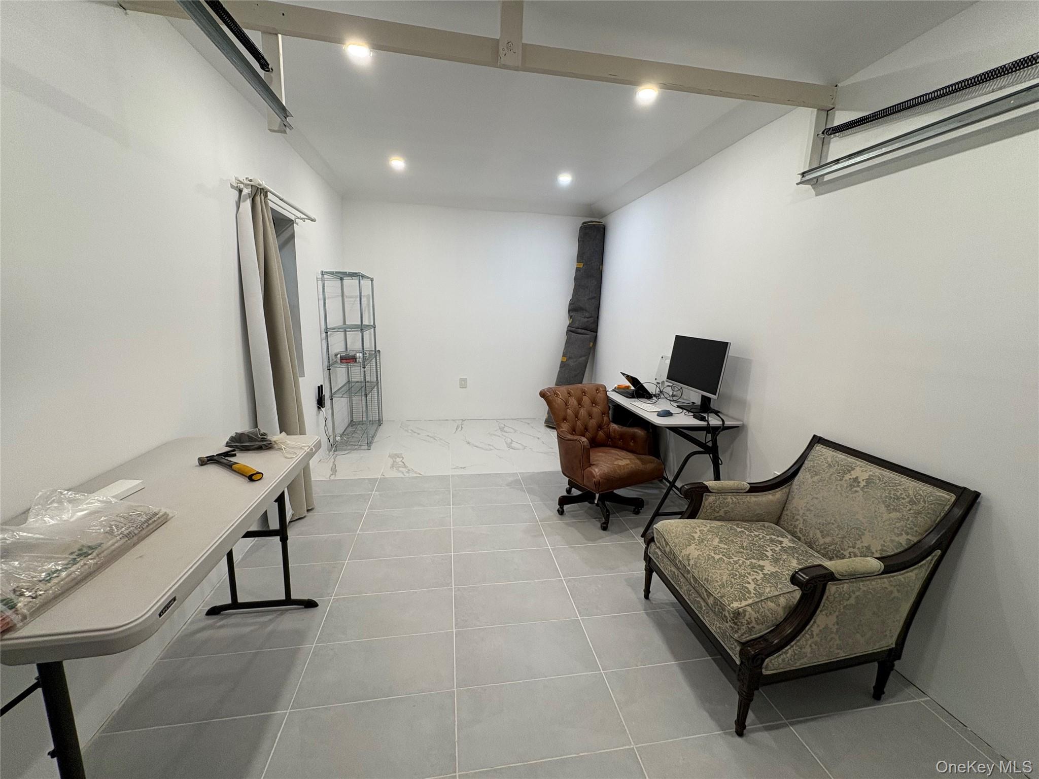 41-75 Morgan Street Queens, NY 11363 - Photo 48 of 50 a living room with furniture a couch and a flat screen tv