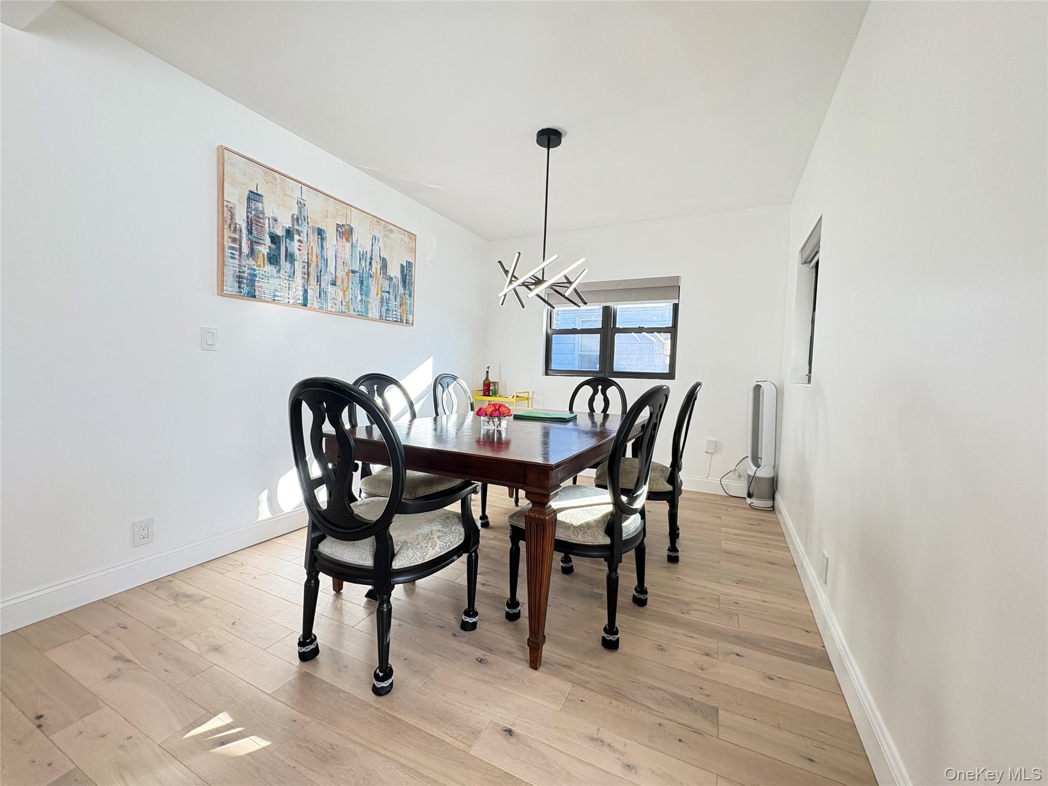 41-75 Morgan Street Queens, NY 11363 - Photo 7 of 50 a view of a dining room with furniture and wooden floor