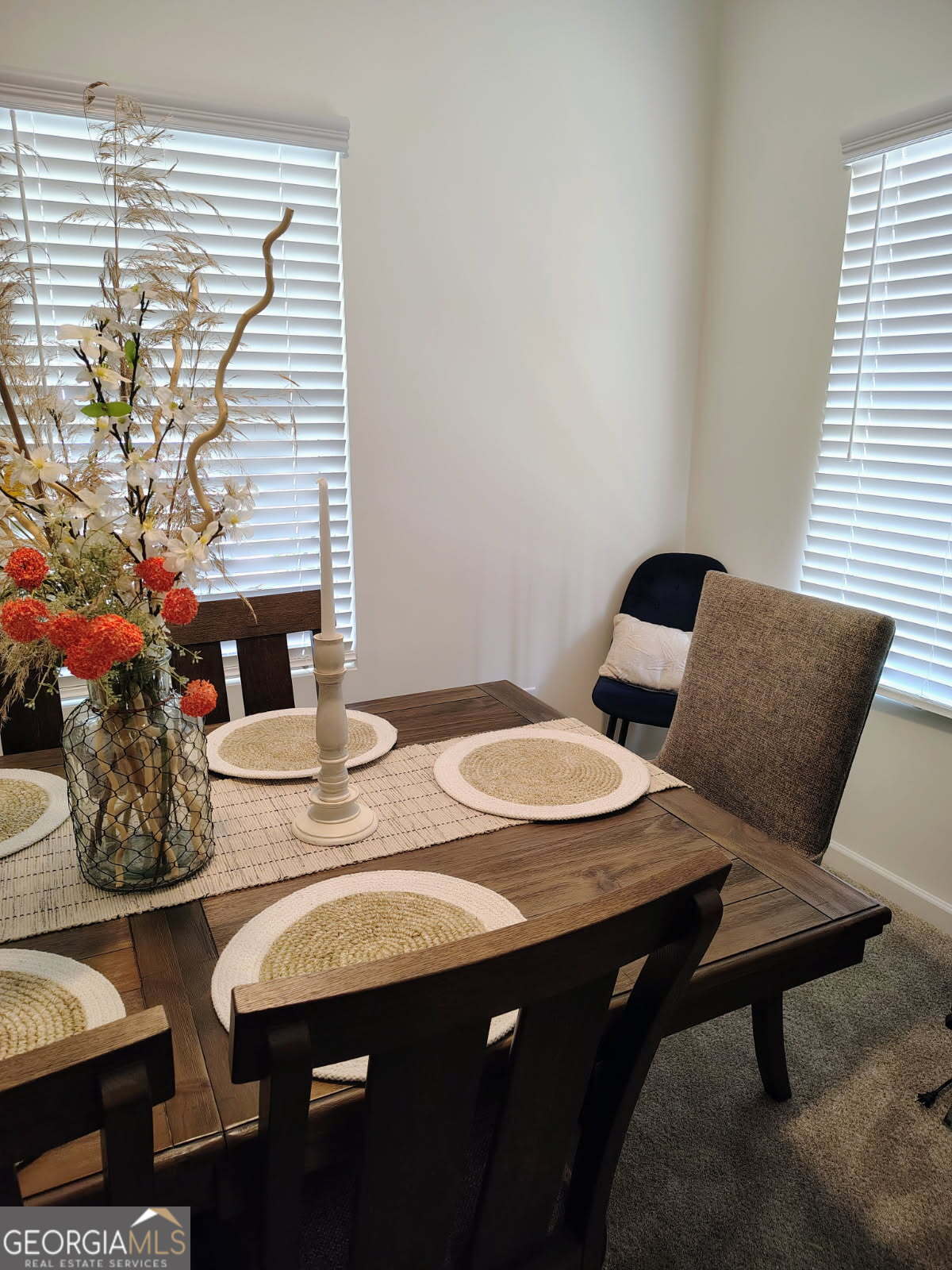 65 Magnolia Street Buchanan, GA 30113 - Photo 30 of 56 a view of a dining room with furniture and wooden floor
