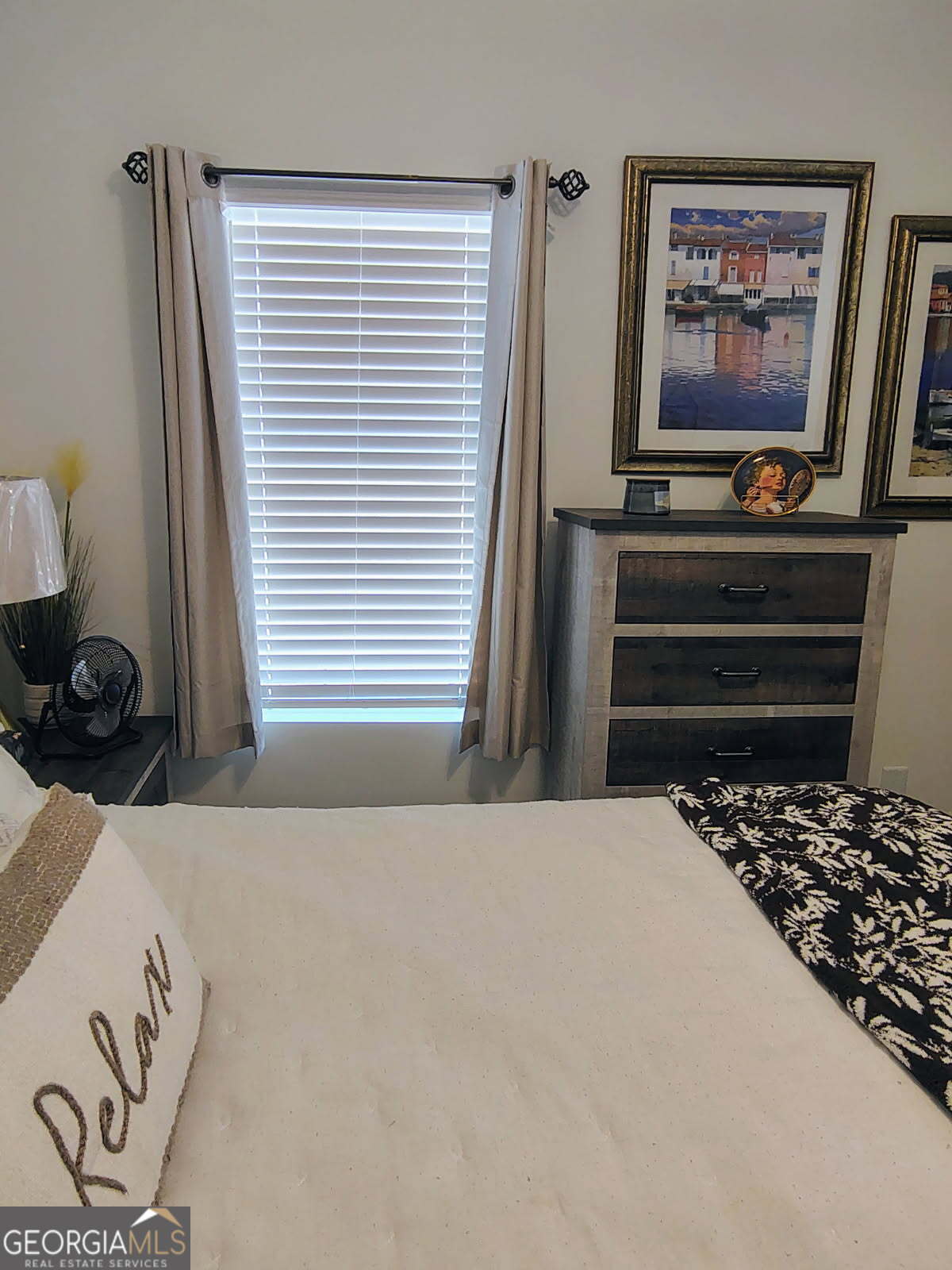 65 Magnolia Street Buchanan, GA 30113 - Photo 37 of 56 a bedroom with a bed and a flat screen tv