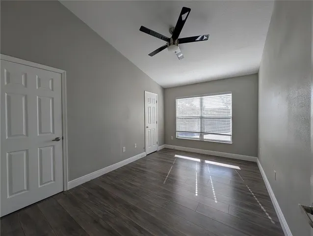 a view of a closet area with wooden floor