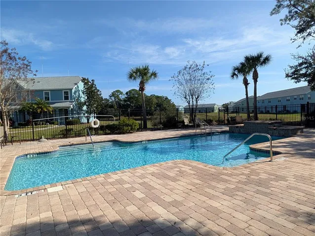a view of a swimming pool with a patio