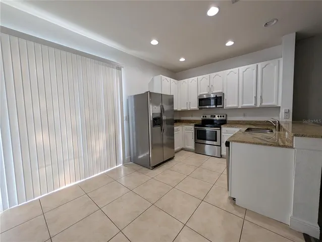 an empty room with wooden floor and closet