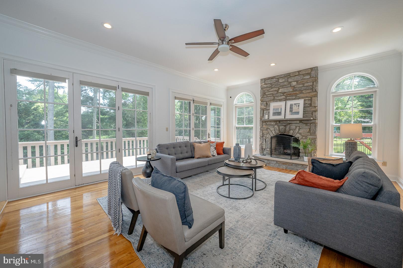899 Black Rock Road Gladwyne, PA 19035 - Photo 13 of 59 a living room with furniture fireplace and a large window