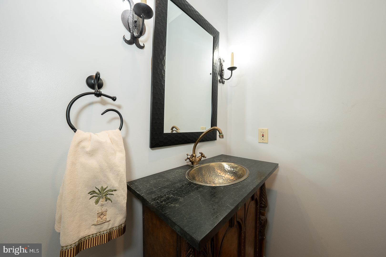 899 Black Rock Road Gladwyne, PA 19035 - Photo 18 of 59 a bathroom with a sink and mirror