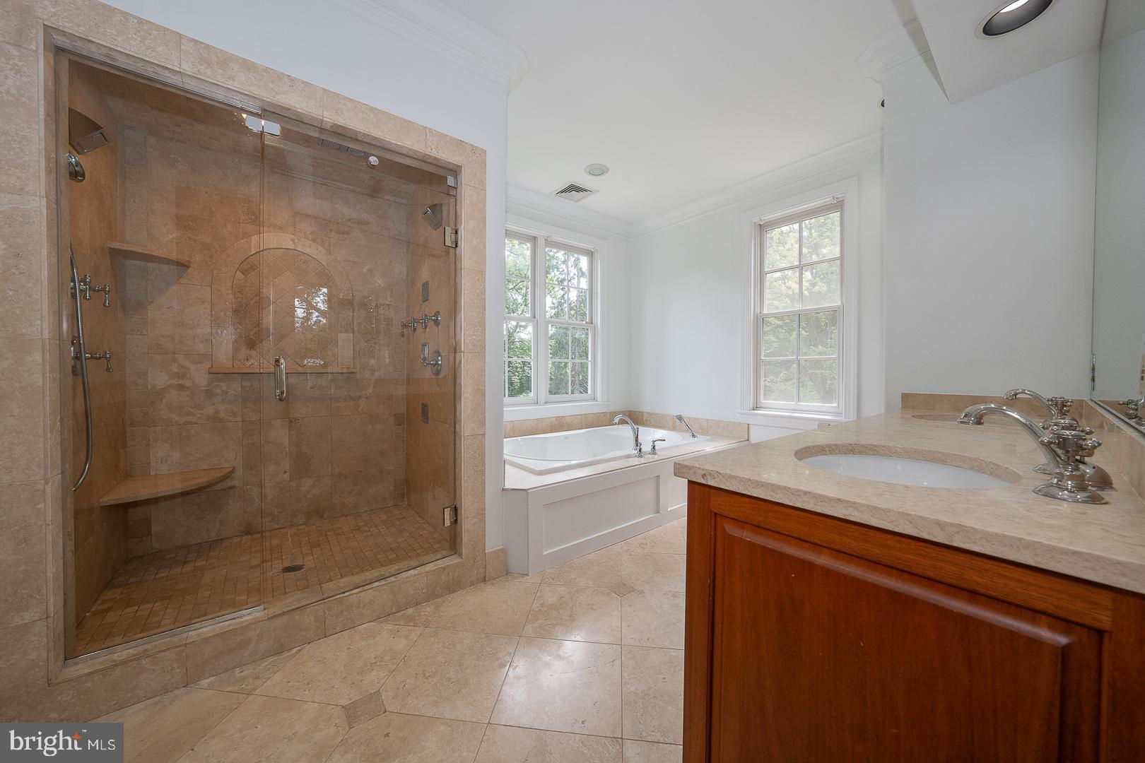 899 Black Rock Road Gladwyne, PA 19035 - Photo 29 of 59 a bathroom with a granite countertop sink a toilet and shower