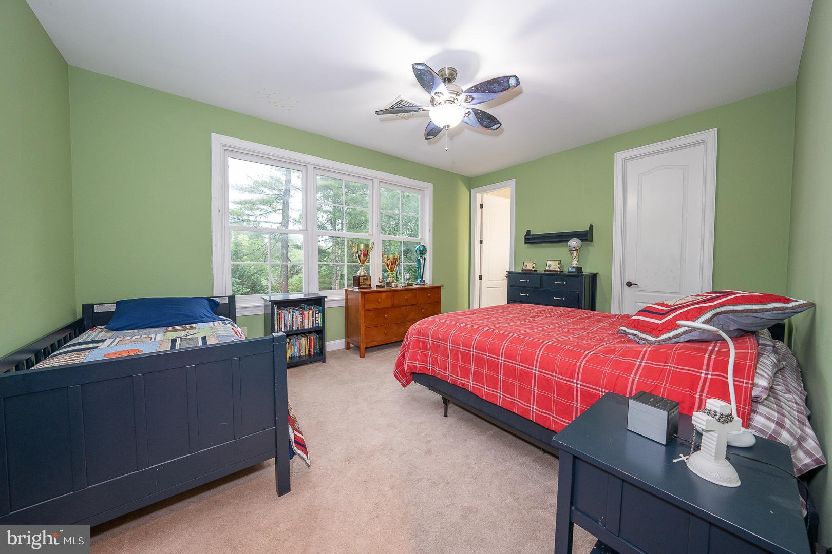 899 Black Rock Road Gladwyne, PA 19035 - Photo 32 of 59 a bedroom with a bed and a chandelier