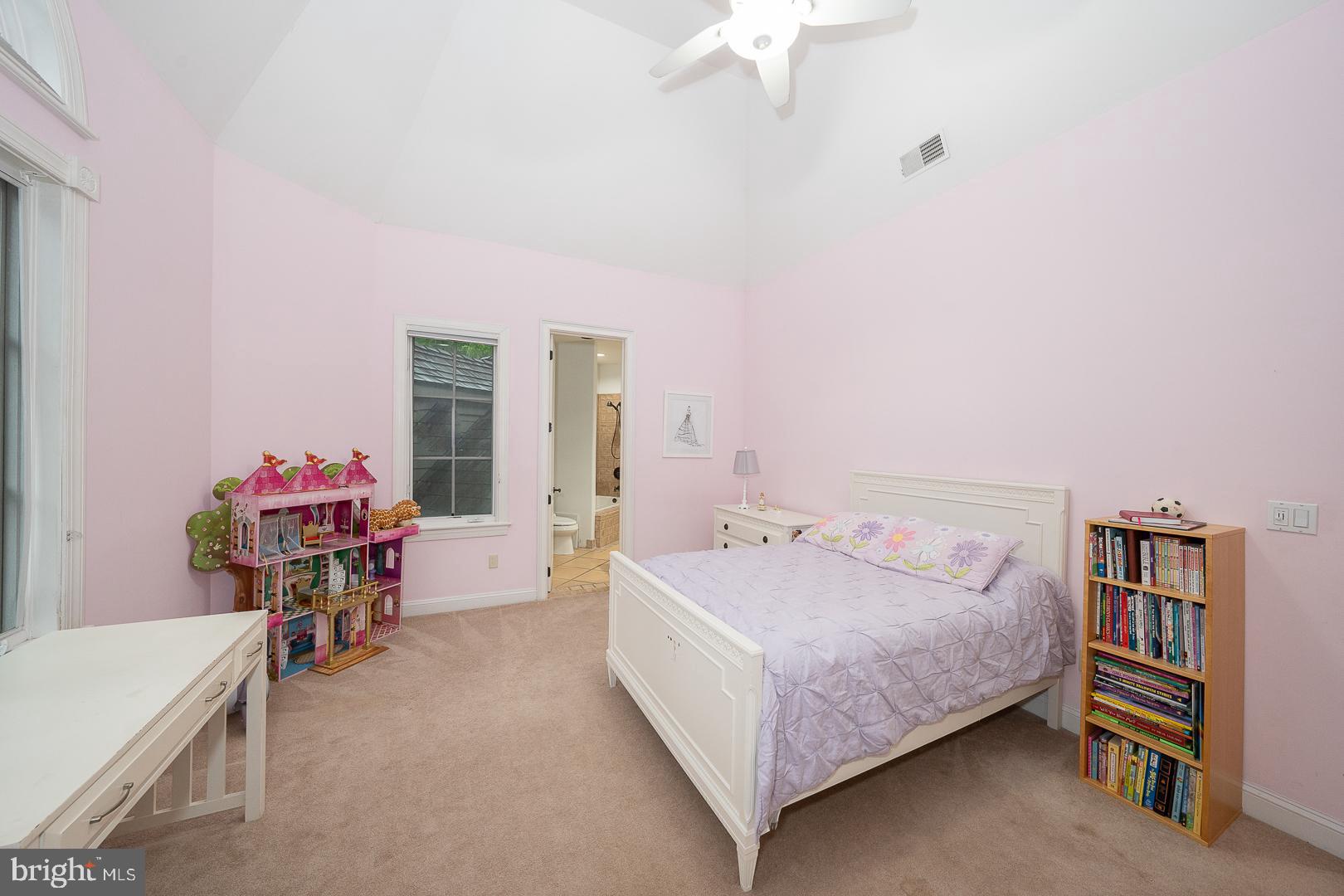 899 Black Rock Road Gladwyne, PA 19035 - Photo 35 of 59 a bedroom with a bed and a chandelier